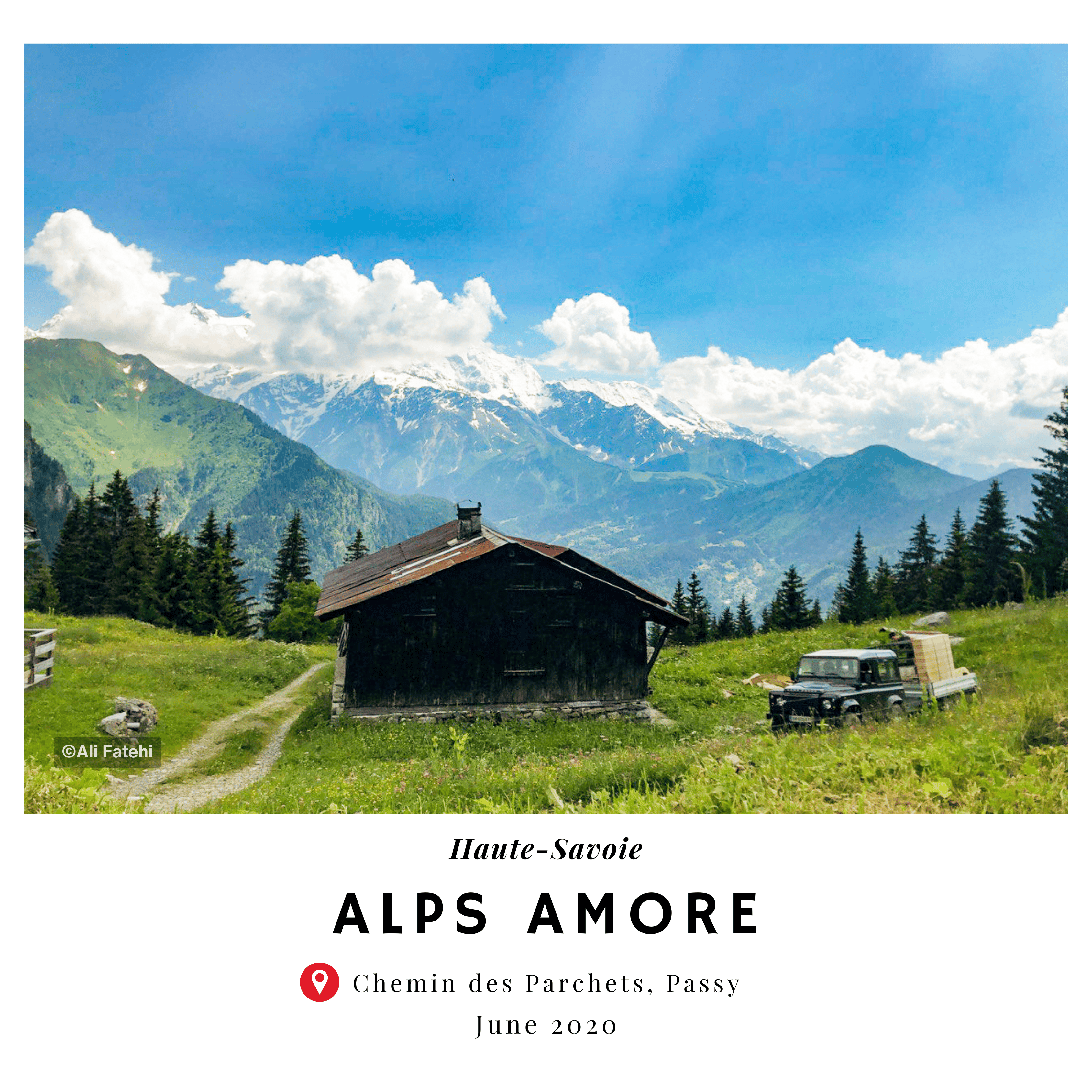 A scenic view of a small mountain hut and an old Land Rover, with snow-capped mountains in the background, taken in Passy, Haute-Savoie, in June 2020.