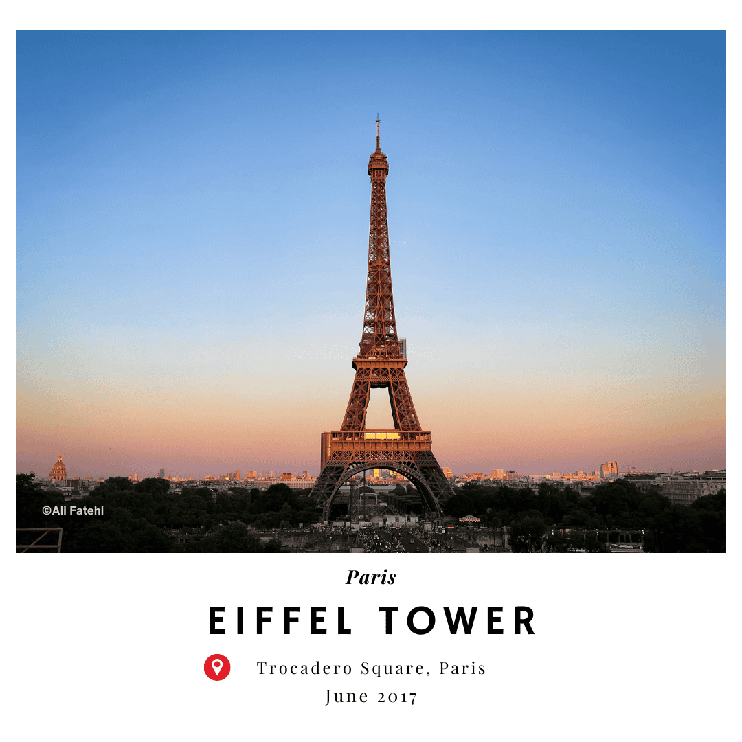 A view of the Eiffel Tower from Trocadero Square, Paris, during sunset, with a warm glow in the sky, taken in June 2017.