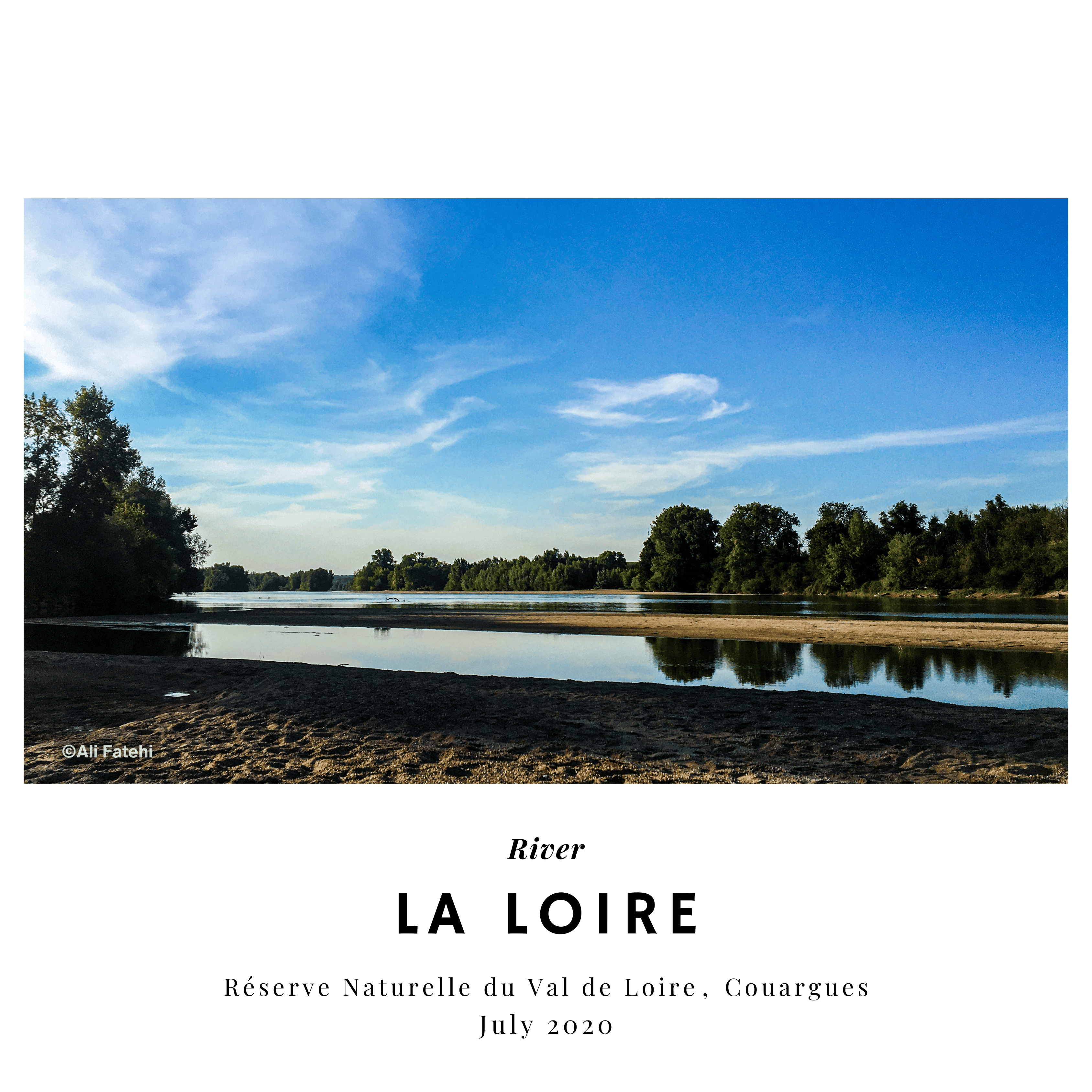 A serene view of the Loire River in the Réserve Naturelle du Val de Loire, with trees reflected in the water, taken in July 2020.