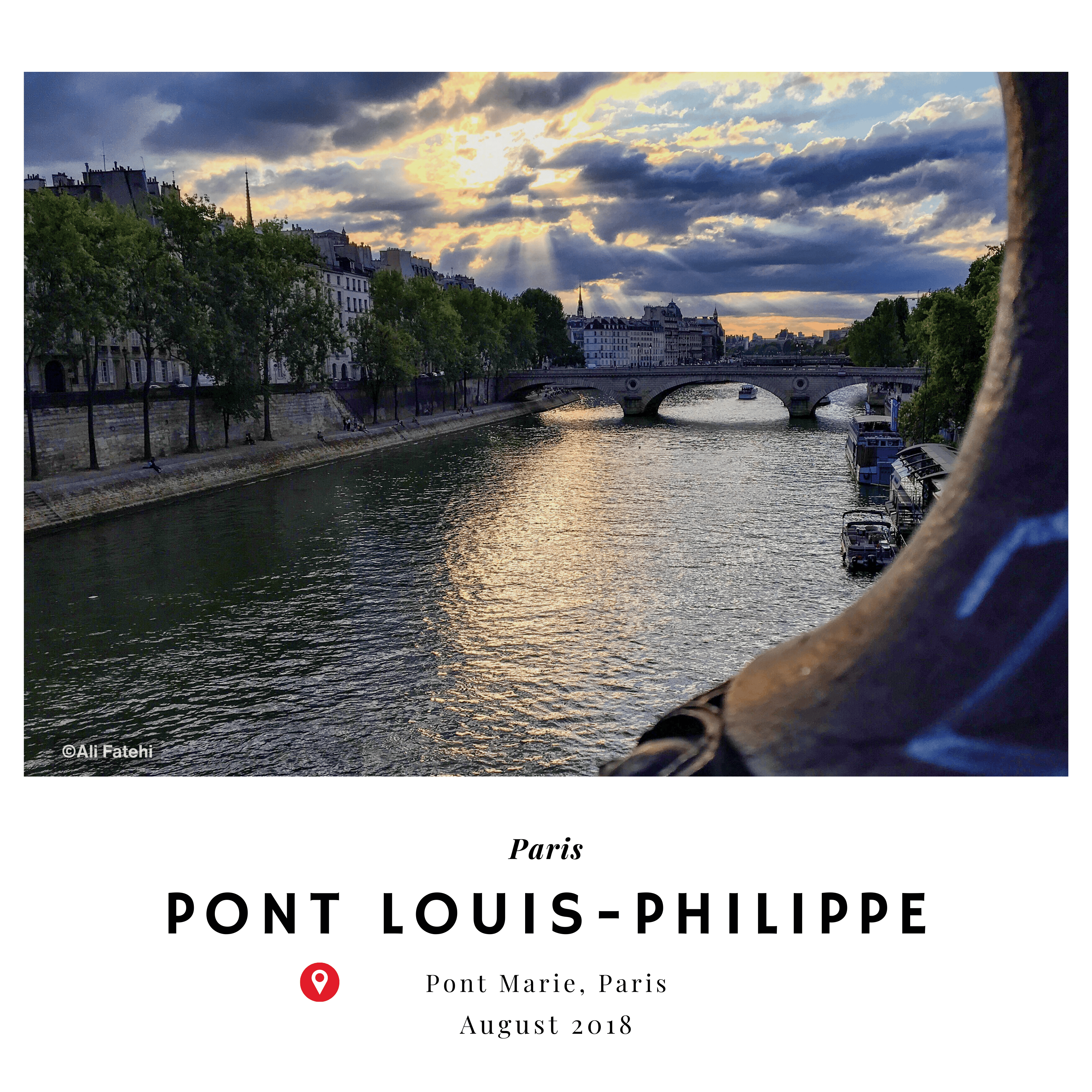 A view of the Pont Louis-Philippe bridge over the Seine River in Paris, with the setting sun and clouds in the background, taken from Pont Marie in August 2018.